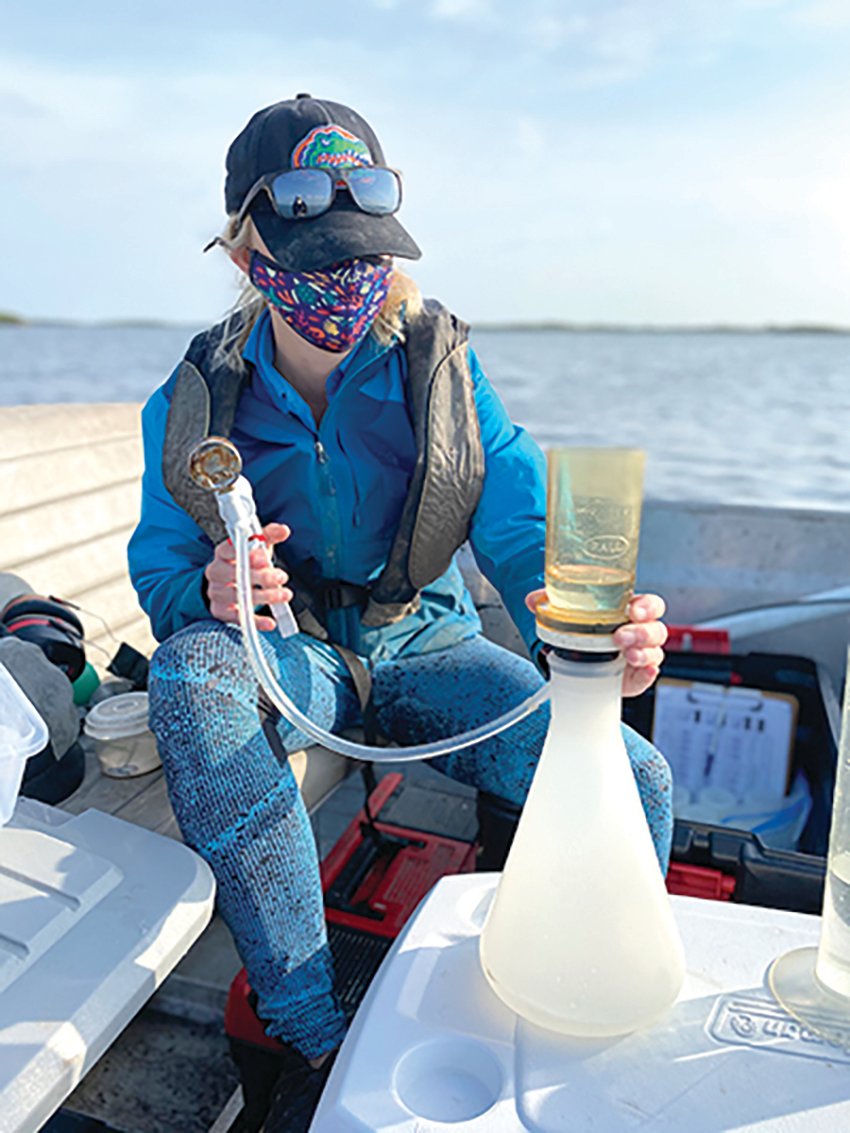 Natalie Stephens, biologist at the UF/IFAS Nature Coast Biological Station, sampling water in the Nature Coast Aquatic Preserve.